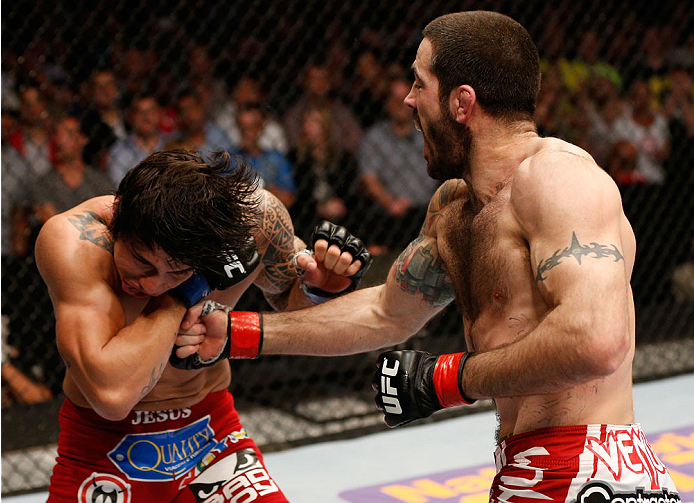 CINCINNATI, OH - MAY 10:  (R-L) Matt Brown punches Erick Silva in their welterweight fight during the UFC Fight Night event at the U.S. Bank Arena on May 10, 2014 in Cincinnati, Ohio. (Photo by Josh Hedges/Zuffa LLC/Zuffa LLC via Getty Images)