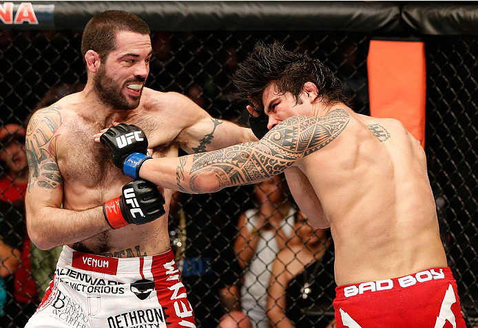CINCINNATI, OH - MAY 10: (L-R) Matt Brown punches Erick Silva in their welterweight fight during the UFC Fight Night event at the U.S. Bank Arena on May 10, 2014 in Cincinnati, Ohio. (Photo by Josh Hedges/Zuffa LLC/Zuffa LLC via Getty Images)