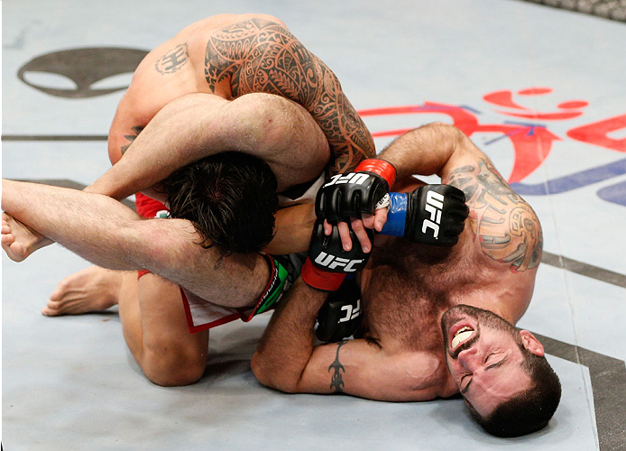 CINCINNATI, OH - MAY 10: (R-L) Matt Brown attempts to secure a triangle arm bar submission against Erick Silva in their welterweight fight during the UFC Fight Night event at the U.S. Bank Arena on May 10, 2014 in Cincinnati, Ohio. (Photo by Josh Hedges/Zuffa LLC/Zuffa LLC via Getty Images)