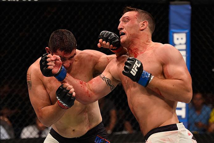 <a href='../fighter/adam-milstead'>Adam Milstead</a> punches <a href='../fighter/chris-de-la-rocha'>Chris De La Rocha</a> during his UFC debut last May