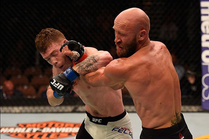 Paul Felder punches <a href='../fighter/Josh-Burkman'>Joshua Burkman</a> during their lightweight bout in May of 2016
