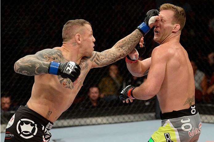 BANGOR, ME - AUGUST 16:  (L-R) Ross Pearson punches Gray Maynard in their lightweight bout during the UFC fight night event at the Cross Insurance Center on August 16, 2014 in Bangor, Maine. (Photo by Jeff Bottari/Zuffa LLC/Zuffa LLC via Getty Images)
