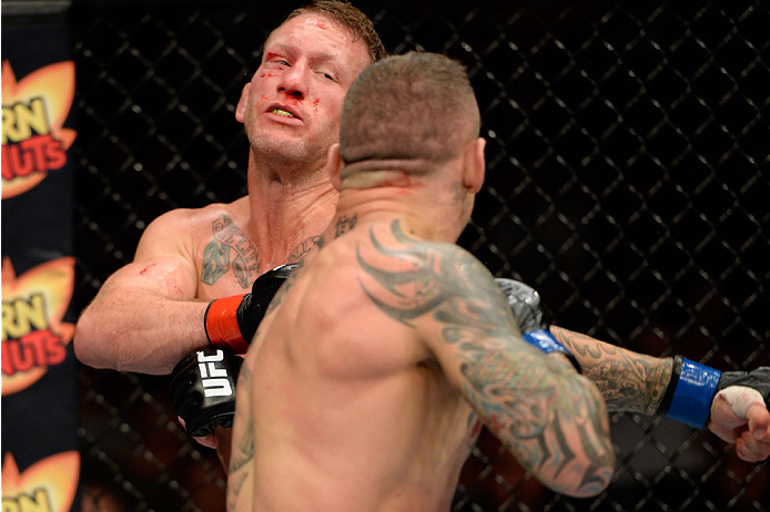 BANGOR, ME - AUGUST 16:  (R-L) Ross Pearson knocks out Gray Maynard in their lightweight bout during the UFC fight night event at the Cross Insurance Center on August 16, 2014 in Bangor, Maine. (Photo by Jeff Bottari/Zuffa LLC/Zuffa LLC via Getty Images)