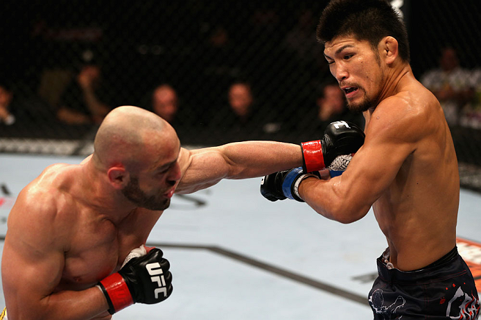 LOS ANGELES, CA - AUGUST 04:  Manny Gamburyan exchanges strikes with Michihiro Omigawa during their Featherweight bout at the UFC on FOX event at Staples Center on August 4, 2012 in Los Angeles, California.  (Photo by Josh Hedges/Zuffa LLC via Getty Images)