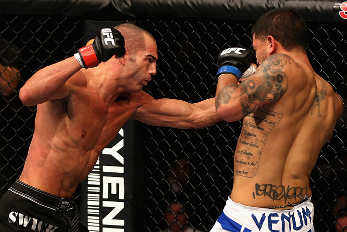 Mike Swick (L) punches Damarques Johnson in their bout during UFC on FOX at Staples Center on 8/4/12 in Los Angeles, CA. (Photo by Josh Hedges)