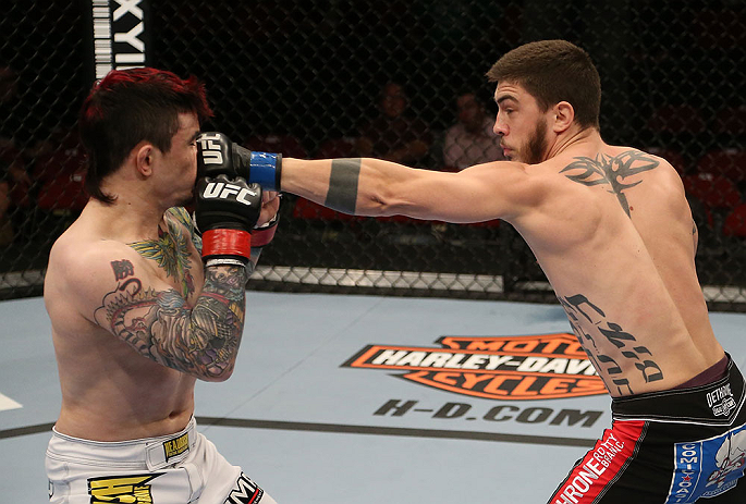 SEATTLE, WA - DECEMBER 08: (R-L) John Albert punches Scott Jorgensen during their bantamweight bout at the UFC on FOX event on December 8, 2012 at Key Arena in Seattle, Washington. (Photo by Ezra Shaw/Zuffa LLC/Zuffa LLC via Getty Images) *** Local Caption *** Scott Jorgensen; John Albert