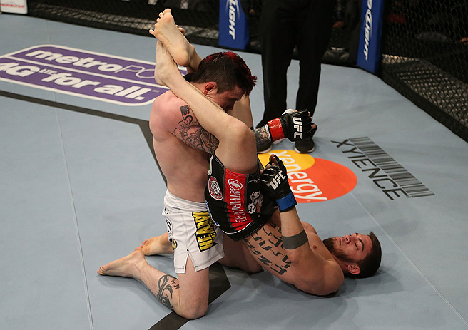SEATTLE, WA - DECEMBER 08: John Albert (R) attempts to submit Scott Jorgensen (L) during their bantamweight bout at the UFC on FOX event on December 8, 2012 at Key Arena in Seattle, Washington. (Photo by Ezra Shaw/Zuffa LLC/Zuffa LLC via Getty Images) *** Local Caption *** Scott Jorgensen; John Albert
