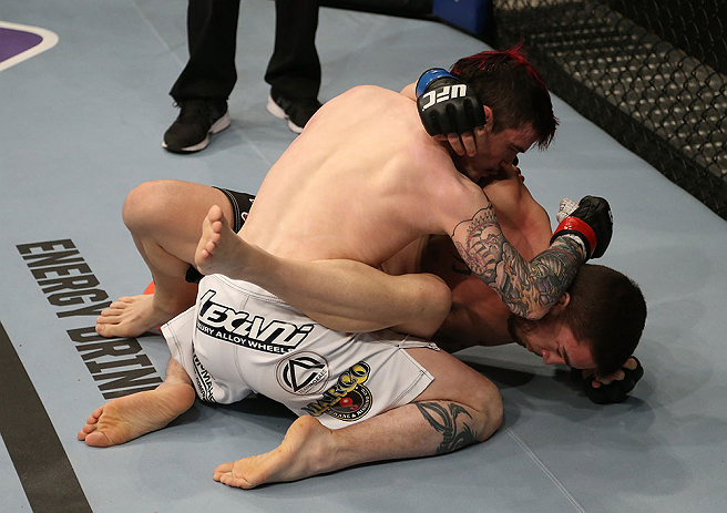 SEATTLE, WA - DECEMBER 08: Scott Jorgensen (L) elbows John Albert (R) during their bantamweight bout at the UFC on FOX event on December 8, 2012 at Key Arena in Seattle, Washington. (Photo by Ezra Shaw/Zuffa LLC/Zuffa LLC via Getty Images) *** Local Caption *** Scott Jorgensen; John Albert