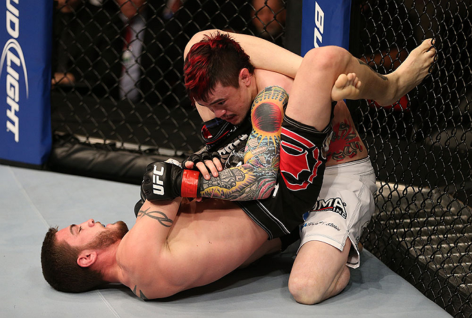 SEATTLE, WA - DECEMBER 08: John Albert (bottom) attempts to submit Scott Jorgensen (top) during their bantamweight bout at the UFC on FOX event on December 8, 2012 at Key Arena in Seattle, Washington. (Photo by Ezra Shaw/Zuffa LLC/Zuffa LLC via Getty Images) *** Local Caption *** Scott Jorgensen; John Albert