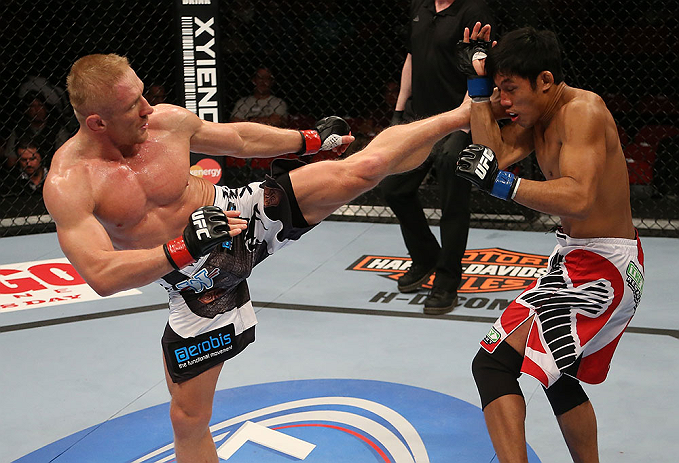 SEATTLE, WA - DECEMBER 08: (L-) Dennis Siver kicks Nam Phan during their featherweight bout at the UFC on FOX event on December 8, 2012 at Key Arena in Seattle, Washington. (Photo by Ezra Shaw/Zuffa LLC/Zuffa LLC via Getty Images) *** Local Caption *** Dennis Siver; Nam Phan