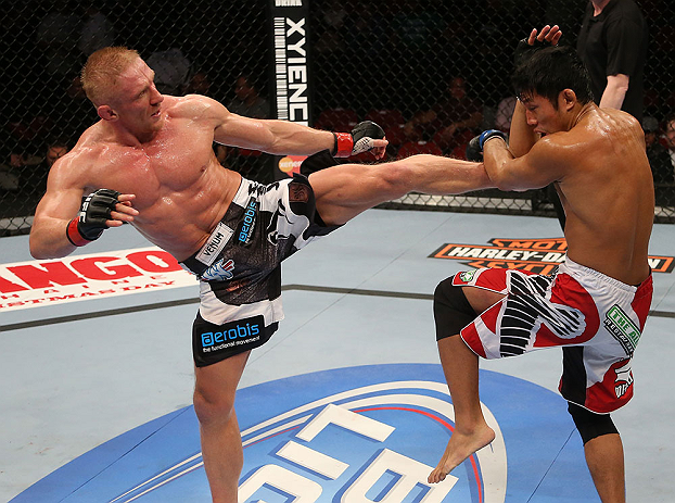 SEATTLE, WA - DECEMBER 08: (L-R) Dennis Siver kicks Nam Phan during their featherweight bout at the UFC on FOX event on December 8, 2012 at Key Arena in Seattle, Washington. (Photo by Ezra Shaw/Zuffa LLC/Zuffa LLC via Getty Images) *** Local Caption *** Dennis Siver; Nam Phan