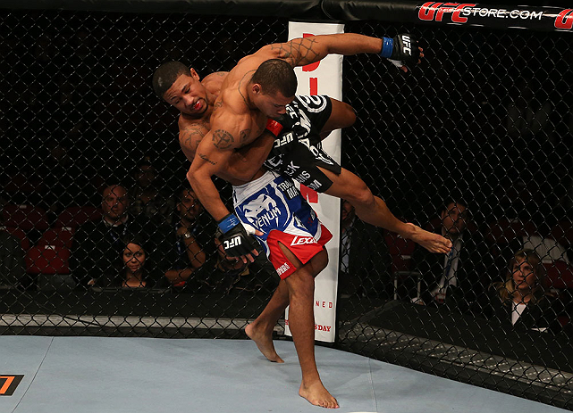 SEATTLE, WA - DECEMBER 08: Marcus LeVesseur (L) lifts Abel Trujillo during their lightweight bout at the UFC on FOX event on December 8, 2012 at Key Arena in Seattle, Washington. (Photo by Ezra Shaw/Zuffa LLC/Zuffa LLC via Getty Images) *** Local Caption *** Marcus LeVesseur; Abel Trujillo