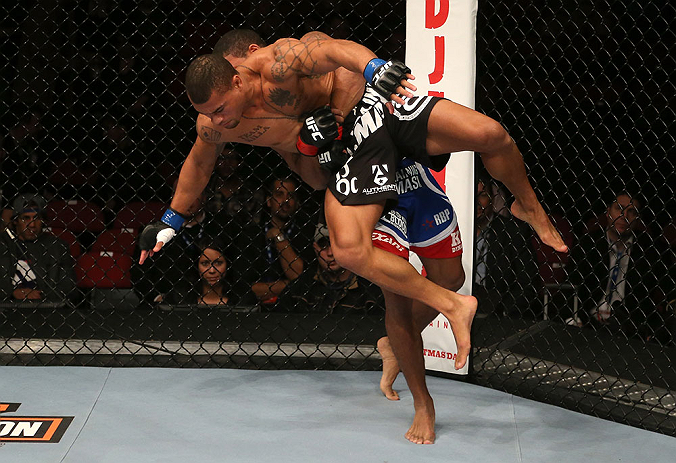 SEATTLE, WA - DECEMBER 08: Abel Trujillo (black shorts) is lifted by Marcus LeVesseur during their lightweight bout at the UFC on FOX event on December 8, 2012 at Key Arena in Seattle, Washington. (Photo by Ezra Shaw/Zuffa LLC/Zuffa LLC via Getty Images) *** Local Caption *** Marcus LeVesseur; Abel Trujillo