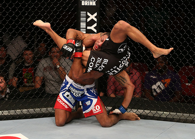 SEATTLE, WA - DECEMBER 08: Marcus LeVesseur (red/white/blue shorts) lifts Abel Trujillo during their lightweight bout at the UFC on FOX event on December 8, 2012 at Key Arena in Seattle, Washington. (Photo by Ezra Shaw/Zuffa LLC/Zuffa LLC via Getty Images) *** Local Caption *** Marcus LeVesseur; Abel Trujillo