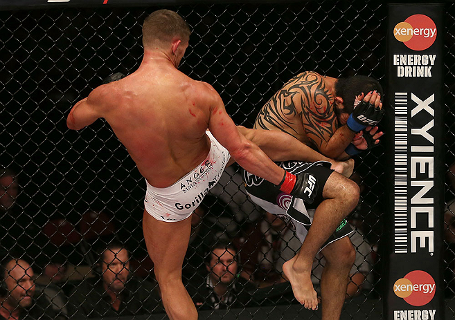 SEATTLE, WA - DECEMBER 08: (L-R) Daron Cruickshank kicks Henry Martinez during their lightweight bout at the UFC on FOX event on December 8, 2012 at Key Arena in Seattle, Washington. (Photo by Ezra Shaw/Zuffa LLC/Zuffa LLC via Getty Images) *** Local Caption *** Daron Cruickshank; Henry Martinez
