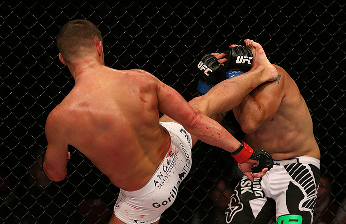 SEATTLE, WA - DECEMBER 08: (L-R) Daron Cruickshank kicks Henry Martinez during their lightweight bout at the UFC on FOX event on December 8, 2012 at Key Arena in Seattle, Washington. (Photo by Ezra Shaw/Zuffa LLC/Zuffa LLC via Getty Images) *** Local Caption *** Daron Cruickshank; Henry Martinez