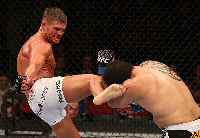 SEATTLE, WA - DECEMBER 08: (L-R) Daron Cruickshank kicks Henry Martinez during their lightweight bout at the UFC on FOX event on December 8, 2012 at Key Arena in Seattle, Washington. (Photo by Ezra Shaw/Zuffa LLC/Zuffa LLC via Getty Images) *** Local Caption *** Daron Cruickshank; Henry Martinez