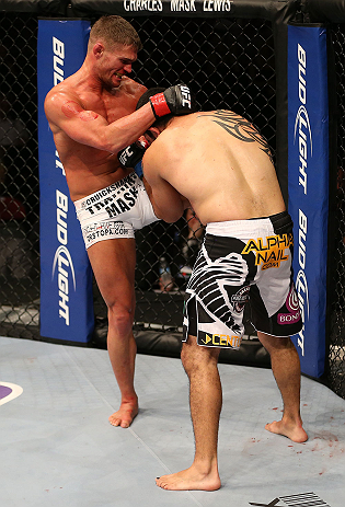 SEATTLE, WA - DECEMBER 08: (L-R) Daron Cruickshank knees Henry Martinez during their lightweight bout at the UFC on FOX event on December 8, 2012 at Key Arena in Seattle, Washington. (Photo by Ezra Shaw/Zuffa LLC/Zuffa LLC via Getty Images) *** Local Caption *** Daron Cruickshank; Henry Martinez