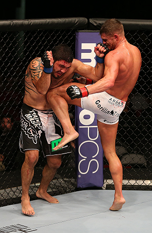 SEATTLE, WA - DECEMBER 08: (R-L) Daron Cruickshank knees Henry Martinez during their lightweight bout at the UFC on FOX event on December 8, 2012 at Key Arena in Seattle, Washington. (Photo by Ezra Shaw/Zuffa LLC/Zuffa LLC via Getty Images) *** Local Caption *** Daron Cruickshank; Henry Martinez