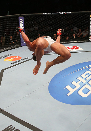 SEATTLE, WA - DECEMBER 08: Daron Cruickshank does a backflip after his knockout victory over Henry Martinez during their lightweight bout at the UFC on FOX event on December 8, 2012 at Key Arena in Seattle, Washington. (Photo by Ezra Shaw/Zuffa LLC/Zuffa LLC via Getty Images) *** Local Caption *** Daron Cruickshank; Henry Martinez