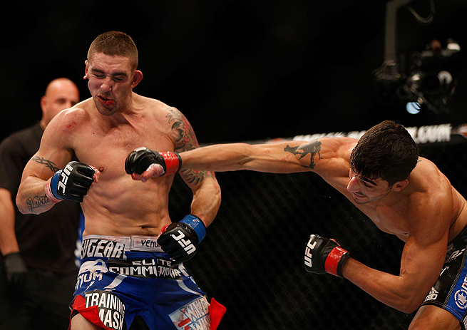 SEATTLE, WA - DECEMBER 08: (R-L) Ramsey Nijem punches Joe Proctor during their lightweight bout at the UFC on FOX event on December 8, 2012 at Key Arena in Seattle, Washington. (Photo by Josh Hedges/Zuffa LLC/Zuffa LLC via Getty Images) *** Local Caption *** Ramsey Nijem; Joe Proctor
