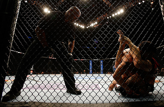 SEATTLE, WA - DECEMBER 08: Referee Dan Miragliotta (left) looks on as Ramsey Nijem and Joe Proctor grapple during their lightweight bout at the UFC on FOX event on December 8, 2012 at Key Arena in Seattle, Washington. (Photo by Josh Hedges/Zuffa LLC/Zuffa LLC via Getty Images) *** Local Caption *** Ramsey Nijem; Joe Proctor