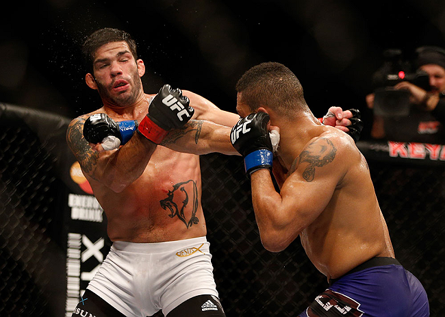 SEATTLE, WA - DECEMBER 08: (R-L) Mike Easton punches Raphael Assuncao during their bantamweight bout at the UFC on FOX event on December 8, 2012 at Key Arena in Seattle, Washington. (Photo by Ezra Shaw/Zuffa LLC/Zuffa LLC via Getty Images) *** Local Caption *** Raphael Assuncao; Mike Easton
