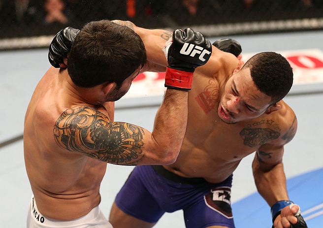 SEATTLE, WA - DECEMBER 08: (R-L) Mike Easton punches Raphael Assuncao during their bantamweight bout at the UFC on FOX event on December 8, 2012 at Key Arena in Seattle, Washington. (Photo by Ezra Shaw/Zuffa LLC/Zuffa LLC via Getty Images) *** Local Caption *** Raphael Assuncao; Mike Easton
