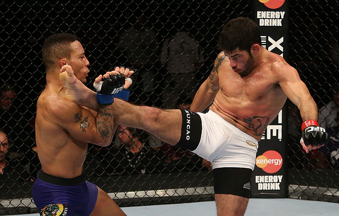 SEATTLE, WA - DECEMBER 08: (R-L) Raphael Assuncao kicks Mike Easton during their bantamweight bout at the UFC on FOX event on December 8, 2012 at Key Arena in Seattle, Washington. (Photo by Ezra Shaw/Zuffa LLC/Zuffa LLC via Getty Images) *** Local Caption *** Raphael Assuncao; Mike Easton