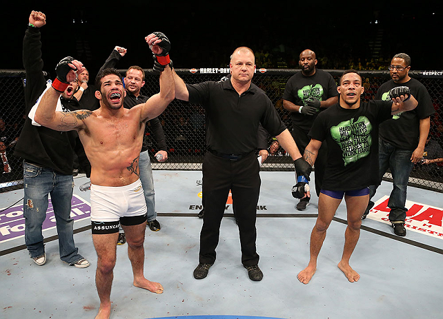 SEATTLE, WA - DECEMBER 08: Raphael Assuncao (left) reacts to being declared the winner over Mike Easton (right) after their bantamweight bout at the UFC on FOX event on December 8, 2012 at Key Arena in Seattle, Washington. (Photo by Ezra Shaw/Zuffa LLC/Zuffa LLC via Getty Images) *** Local Caption *** Raphael Assuncao; Mike Easton