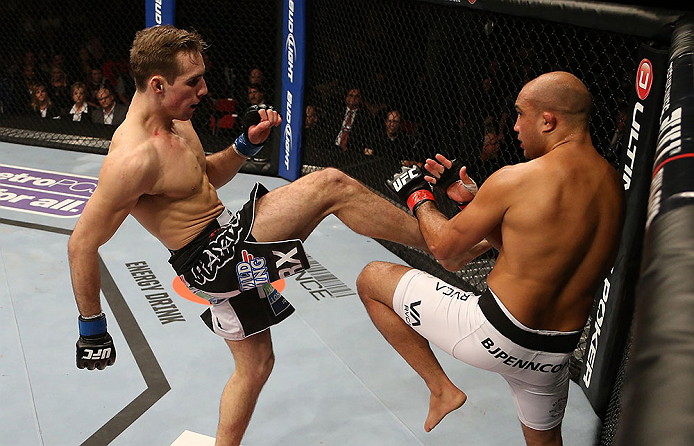 SEATTLE, WA - DECEMBER 08: (L-R) Rory MacDonald kicks BJ Penn during their welterweight bout at the UFC on FOX event on December 8, 2012 at Key Arena in Seattle, Washington. (Photo by Ezra Shaw/Zuffa LLC/Zuffa LLC via Getty Images) *** Local Caption *** BJ Penn; Rory MacDonald