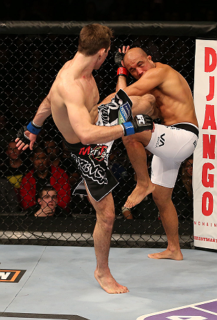 SEATTLE, WA - DECEMBER 08: (L-R) Rory MacDonald kicks BJ Penn during their welterweight bout at the UFC on FOX event on December 8, 2012 at Key Arena in Seattle, Washington. (Photo by Ezra Shaw/Zuffa LLC/Zuffa LLC via Getty Images) *** Local Caption *** BJ Penn; Rory MacDonald