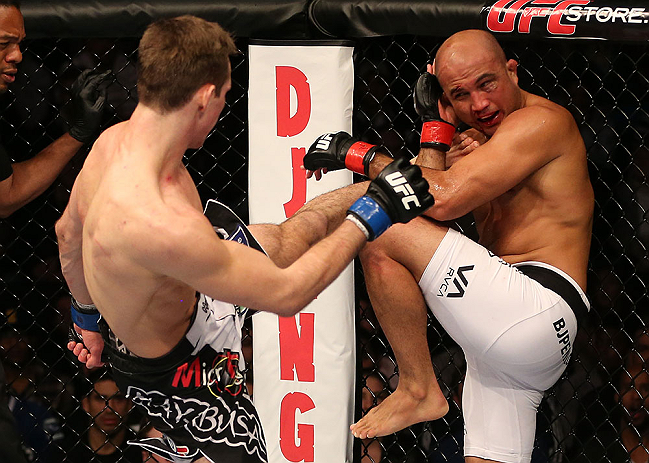 SEATTLE, WA - DECEMBER 08:  (L-R) Rory MacDonald kicks BJ Penn during their welterweight bout at the UFC on FOX event on December 8, 2012  at Key Arena in Seattle, Washington.  (Photo by Ezra Shaw/Zuffa LLC/Zuffa LLC via Getty Images) *** Local Caption *** BJ Penn; Rory MacDonald