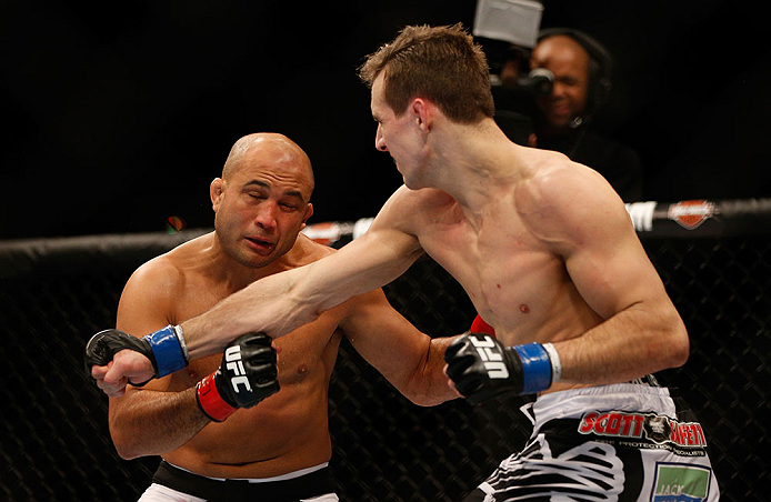 SEATTLE, WA - DECEMBER 08: (R-L) Rory MacDonald punches BJ Penn during their welterweight bout at the UFC on FOX event on December 8, 2012 at Key Arena in Seattle, Washington. (Photo by Josh Hedges/Zuffa LLC/Zuffa LLC via Getty Images) *** Local Caption *** BJ Penn; Rory MacDonald