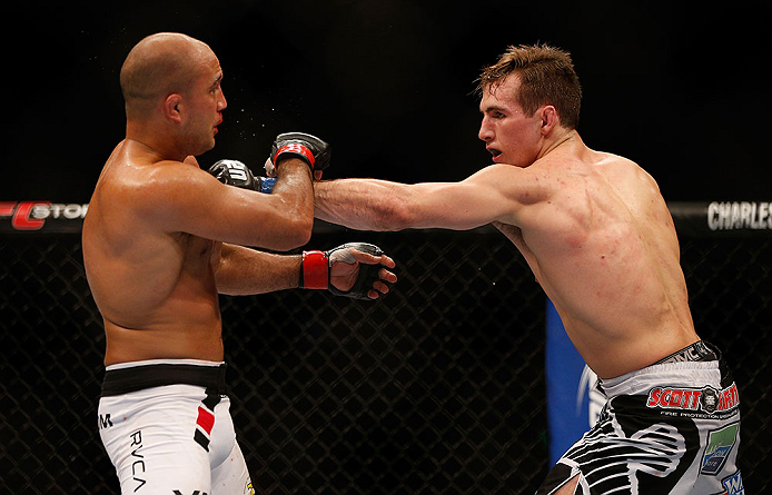 SEATTLE, WA - DECEMBER 08: (R-L) Rory MacDonald punches BJ Penn during their welterweight bout at the UFC on FOX event on December 8, 2012 at Key Arena in Seattle, Washington. (Photo by Josh Hedges/Zuffa LLC/Zuffa LLC via Getty Images) *** Local Caption *** BJ Penn; Rory MacDonald