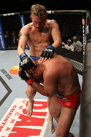 SEATTLE, WA - DECEMBER 08: Alexander Gustafsson (top) knees Mauricio Rua during their light heavyweight bout at the UFC on FOX event on December 8, 2012 at Key Arena in Seattle, Washington. (Photo by Ezra Shaw/Zuffa LLC/Zuffa LLC via Getty Images) *** Local Caption *** Mauricio Rua; Alexander Gustafsson