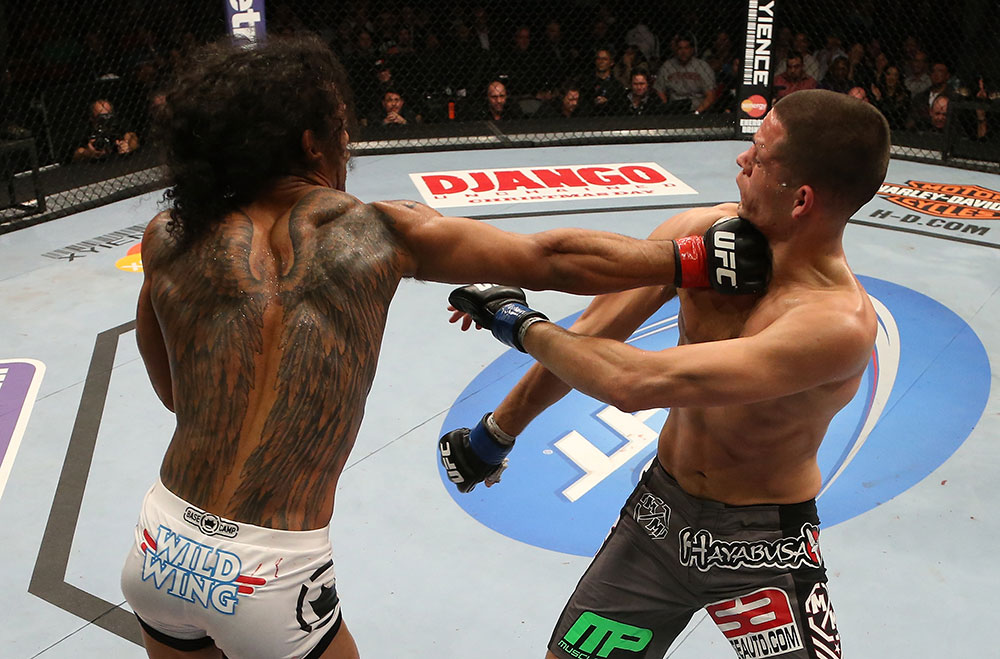 SEATTLE, WA - DECEMBER 08: (L-R) Benson Henderson punches Nate Diaz during their lightweight championship bout at the UFC on FOX event on December 8, 2012 at Key Arena in Seattle, Washington. (Photo by Ezra Shaw/Zuffa LLC/Zuffa LLC via Getty Images) *** Local Caption *** Benson Henderson; Nate Diaz