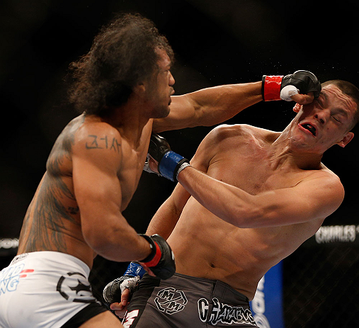 SEATTLE, WA - DECEMBER 08: Benson Henderson (L) punches Nate Diaz (R) during their lightweight championship bout at the UFC on FOX event on December 8, 2012 at Key Arena in Seattle, Washington. (Photo by Josh Hedges/Zuffa LLC/Zuffa LLC via Getty Images) *** Local Caption *** Benson Henderson; Nate Diaz
