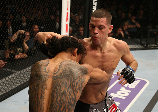 SEATTLE, WA - DECEMBER 08: (R-L) Nate Diaz punches Benson Henderson during their lightweight championship bout at the UFC on FOX event on December 8, 2012 at Key Arena in Seattle, Washington. (Photo by Ezra Shaw/Zuffa LLC/Zuffa LLC via Getty Images) *** Local Caption *** Benson Henderson; Nate Diaz