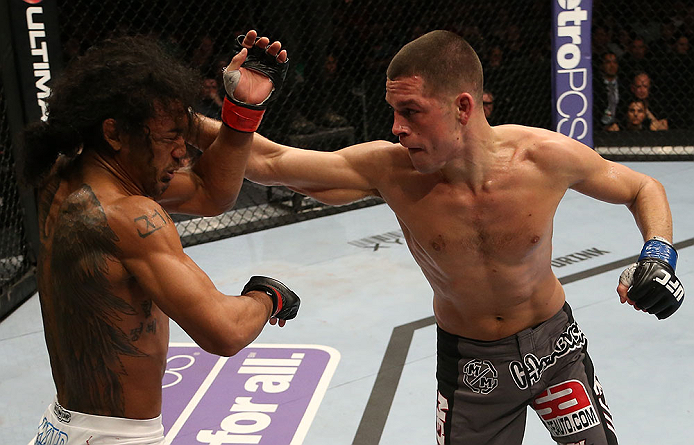 SEATTLE, WA - DECEMBER 08: (R-L) Nate Diaz punches Benson Henderson during their lightweight championship bout at the UFC on FOX event on December 8, 2012 at Key Arena in Seattle, Washington. (Photo by Ezra Shaw/Zuffa LLC/Zuffa LLC via Getty Images) *** Local Caption *** Benson Henderson; Nate Diaz