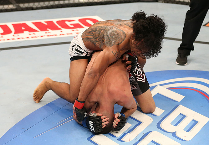 SEATTLE, WA - DECEMBER 08:  Benson Henderson (top) punches Nate Diaz during their lightweight championship bout at the UFC on FOX event on December 8, 2012  at Key Arena in Seattle, Washington.  (Photo by Ezra Shaw/Zuffa LLC/Zuffa LLC via Getty Images) *** Local Caption *** Benson Henderson; Nate Diaz