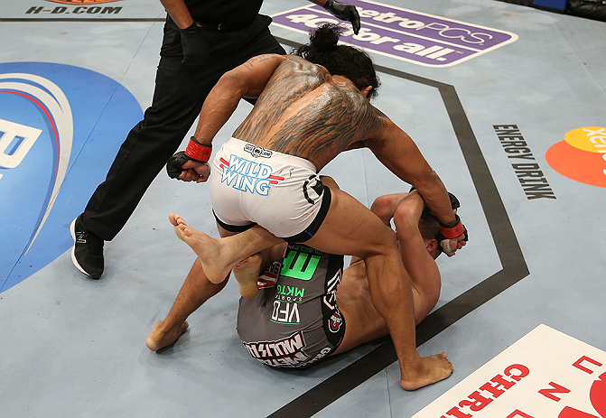 SEATTLE, WA - DECEMBER 08: (top-bottom) Benson Henderson punches Nate Diaz during their lightweight championship bout at the UFC on FOX event on December 8, 2012 at Key Arena in Seattle, Washington. (Photo by Ezra Shaw/Zuffa LLC/Zuffa LLC via Getty Images) *** Local Caption *** Benson Henderson; Nate Diaz
