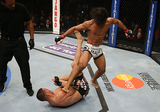 SEATTLE, WA - DECEMBER 08: Benson Henderson (white shorts) kicks Nate Diaz (bottom) during their lightweight championship bout at the UFC on FOX event on December 8, 2012 at Key Arena in Seattle, Washington. (Photo by Ezra Shaw/Zuffa LLC/Zuffa LLC via Getty Images) *** Local Caption *** Benson Henderson; Nate Diaz