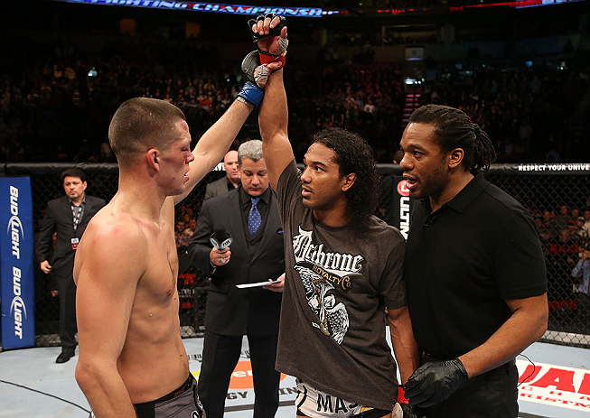 SEATTLE, WA - DECEMBER 08: Nate Diaz (left) raises Benson Henderson's hand after their lightweight championship bout at the UFC on FOX event on December 8, 2012 at Key Arena in Seattle, Washington. (Photo by Ezra Shaw/Zuffa LLC/Zuffa LLC via Getty Images) *** Local Caption *** Benson Henderson; Nate Diaz