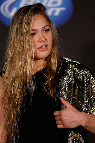 SEATTLE, WA - DECEMBER 06: Ronda Rousey poses for photos after being presented with the UFC women's bantamweight championship during the UFC on FOX press conference on December 6, 2012 at Key Arena in Seattle, Washington. (Photo by Josh Hedges/Zuffa LLC/Zuffa LLC via Getty Images)