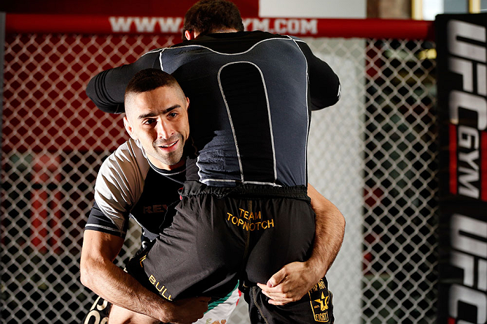 CHICAGO, IL - JANUARY 23:  Ricardo Lamas (L) conducts an open workout session for media on January 23, 2013 at UFC Gym in Chicago, Illinois. (Photo by Josh Hedges/Zuffa LLC/Zuffa LLC via Getty Images)