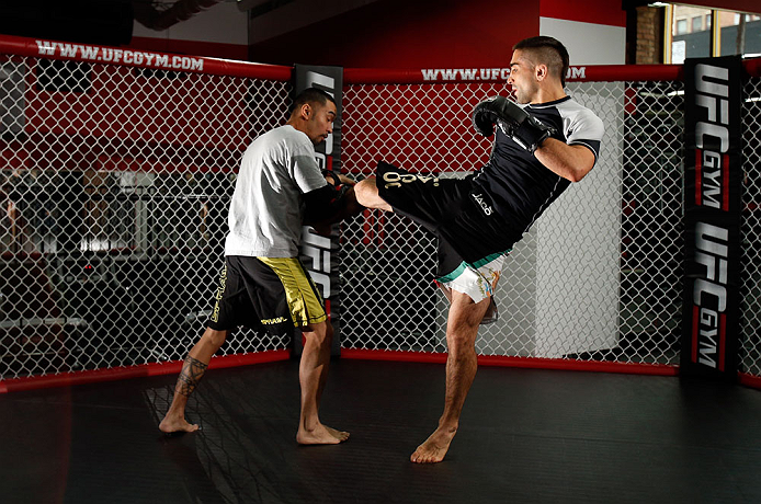 CHICAGO, IL - JANUARY 23:  Ricardo Lamas (R) conducts an open workout session for media on January 23, 2013 at UFC Gym in Chicago, Illinois. (Photo by Josh Hedges/Zuffa LLC/Zuffa LLC via Getty Images)