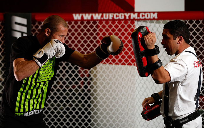 CHICAGO, IL - JANUARY 23:  Donald "Cowboy" Cerrone (L) conducts an open workout session for media on January 23, 2013 at UFC Gym in Chicago, Illinois. (Photo by Josh Hedges/Zuffa LLC/Zuffa LLC via Getty Images)