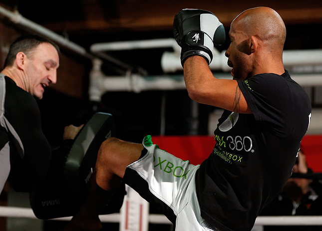 CHICAGO, IL - JANUARY 23:  Demetrious "Mighty Mouse" Johnson (R) conducts an open workout session for media on January 23, 2013 at UFC Gym in Chicago, Illinois. (Photo by Josh Hedges/Zuffa LLC/Zuffa LLC via Getty Images)