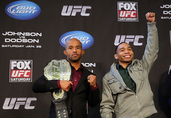 CHICAGO, IL - JANUARY 24: (L-R) Opponents Demetrious "Mighty Mouse" Johnson and John Dodson pose for photos during the UFC on FOX press conference on January 24, 2013 at the United Center in Chicago, Illinois. (Photo by Josh Hedges/Zuffa LLC/Zuffa LLC via Getty Images)